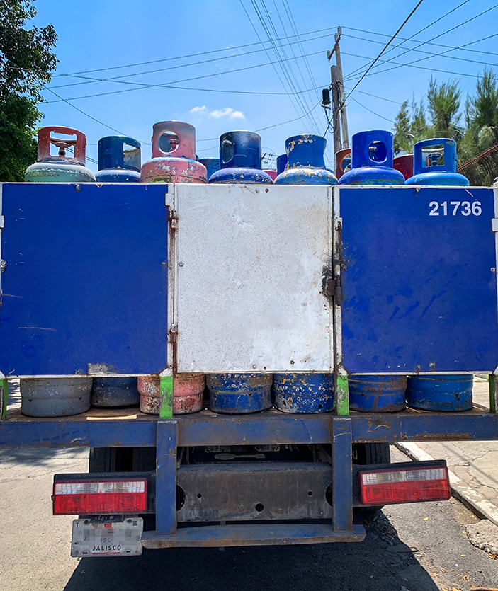 Guadalajara, Mexico - September 4 2019: Zeta Gas truck carrying gas cilinder tanks for home use  in Zapopan, Jalisco