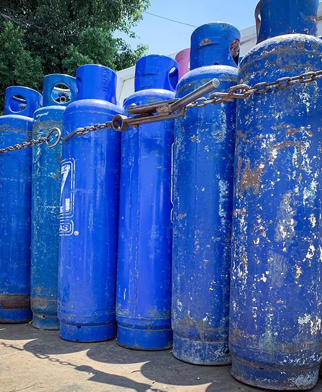 Guadalajara, Mexico - September 04 2019: Blue Gas tanks on a Zeta Gas truck secured with a metal chain, to be home delivered