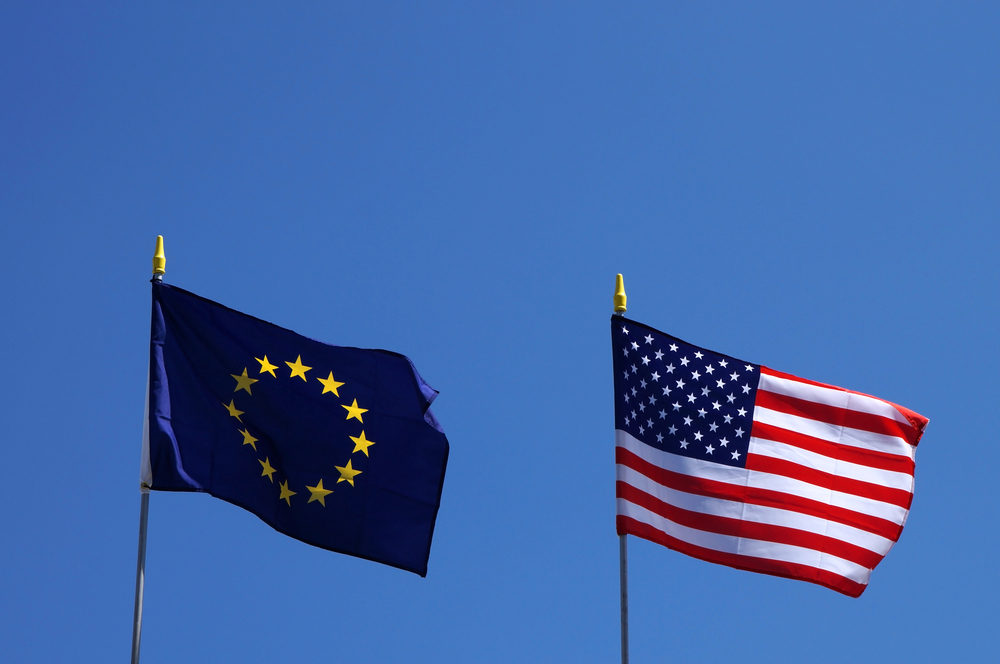 Usa,And,Eu,Flags,Next,To,Each,Other,Waving,In