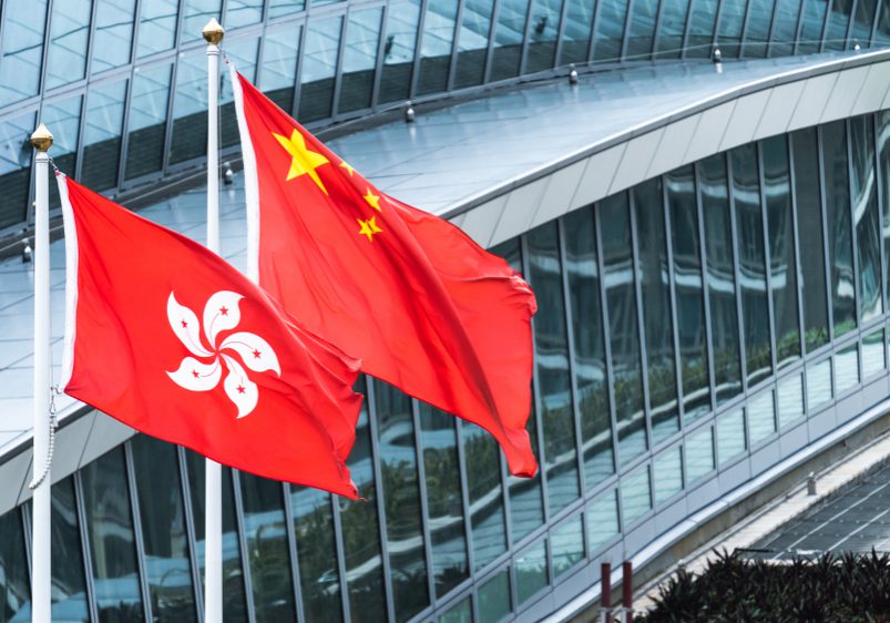 Hong,Kong,And,Mainland,China,National,Flags,Stand,Together,With